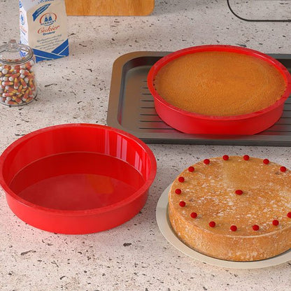 2 Moules en silicone rouge sur plaque de cuisson